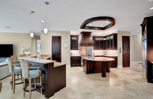 Waterway Park House | Sprawling intercoastal home with boat lifts, pool and hot tub