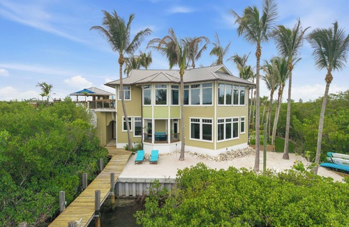 Wabasso Beach House | Stunning Riverfront Home with Private Beach and Close to the Ocean.
