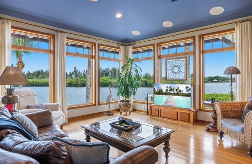 Wabasso Beach House | Stunning Riverfront Home with Private Beach and Close to the Ocean.