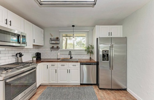 Whitfield House | Stylish, Light-Filled Living with Cozy Fireplace & Farmhouse Finishes