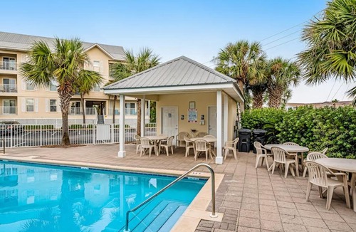 Navarre Beach House | Sunny coastal condo with pool balcony & sound view - walk to the beach