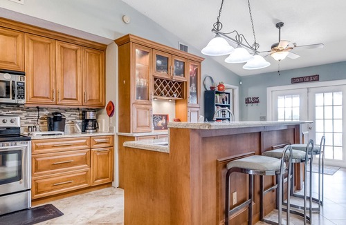 Lake Worth House | Sunny home with private screened pool, spacious patio & fast WiFi