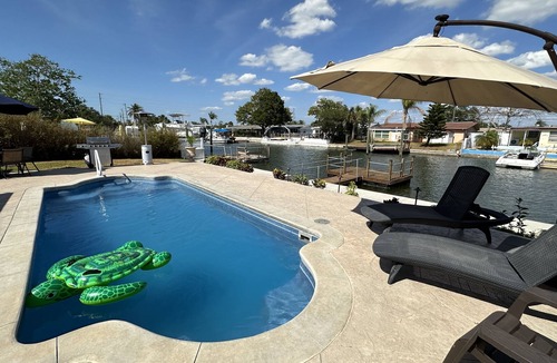 Hudson Beach Estates House | Sunny Waterfront Oasis! Private Pool, Hot Tub & Dock!