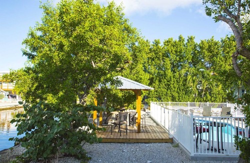 Port Pine Heights House | Sunset Hideaway, Pool home on canal