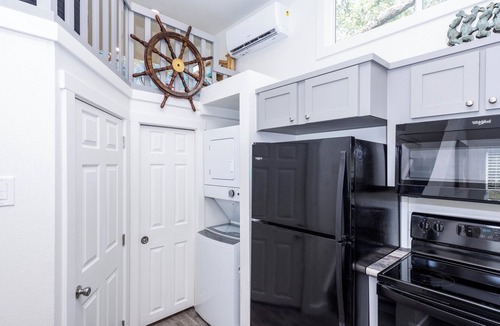 Rockport Cottage | The Live Oak Tiny House with fence