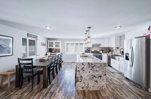 Edgewater House | The Mile High Haven: An Entertainers Dream Home with Hot Tub + Perfect Location
