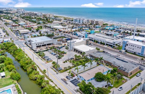 Cocoa Beach Apartment | The Shark Tank TownCenter Walk to Beach Bars Shops & Downtown Cocoa Beach