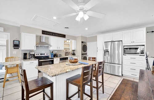 Cocoa Isles House | TIKI BLUE Big beach house with heated pool, hot tub and Tiki Bar.