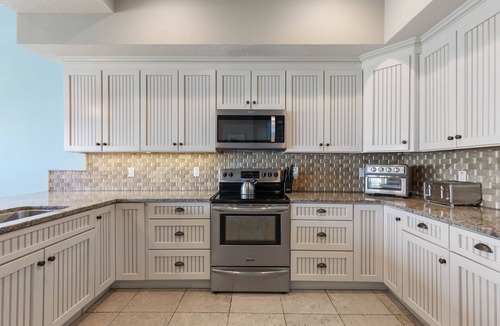 Palm Coast House | Tiki Tides Oceanfront Beach Home 7BR, Elevator, Heated Pool & Private Boardwalk