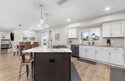 Saint James City House | TWO MASTER SUITES-POOL -WATERFRONT ON CORNER LOT - BOAT LIFT -OUTDOOR KITCHEN