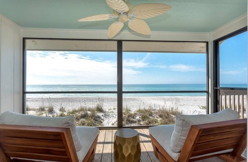 Palm Island Villa | Updated Beachfront Villa! Off the porch and onto the sand on secluded island.