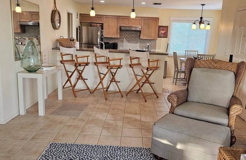Palm Island Condo | Waterfront 2BR beach & lagoon retreat. Dock, pool, dog-friendly. Incommunicado!
