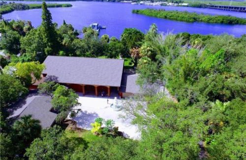 Riverview Villa | Waterfront 6BR Oasis, Pool, Gym, Huge Dock