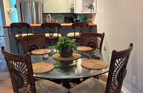 Inverness Condo | Waterfront condo, community pool overlooking the canal leading to Henderson Lake