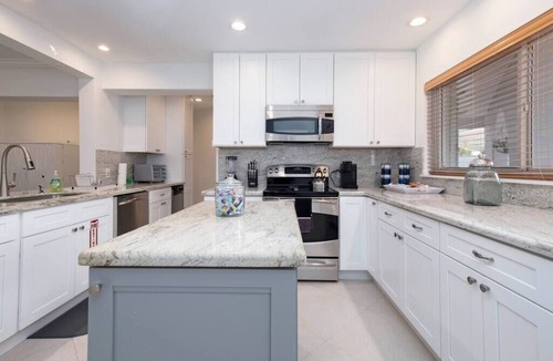 South New River Isles House | Waterfront Haven! 4BR/2.5BA + Solar Heated Pool