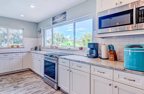Cocoa Isles House | Waterfront home with saltwater pool, private dock, central AC & washer/dryer