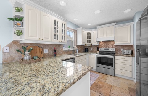 Palm Harbor House | Waterfront Oasis - Heated Pool, Kayaks + Game Room