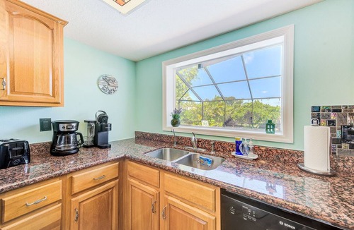 Apollo Beach House | Waterfront Oasis w/screened Lanai & Heated Pool, Private Dock + Kayaks 3BR/2BA