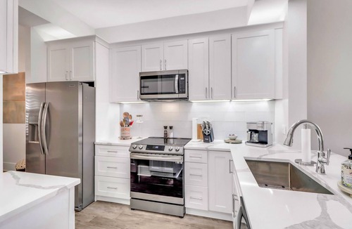 Redevelopment Area Condo | YOUR COASTAL RETREAT, WALK TO BEACH, SHOPPING AND 5TH AVE!