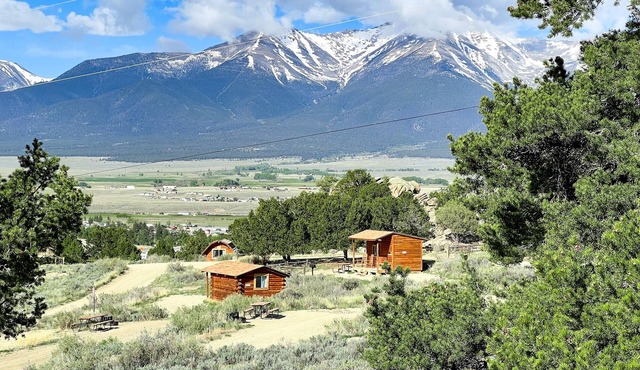 1 Room Camping Cabin without a bathroom or running water. Sleeps up to 5 in one queen bed and a custom made triple bunk bed (bunk beds made on request).