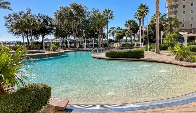 3rd-floor beach & pool-view condo with outdoor pool, hot tub, grills, balcony