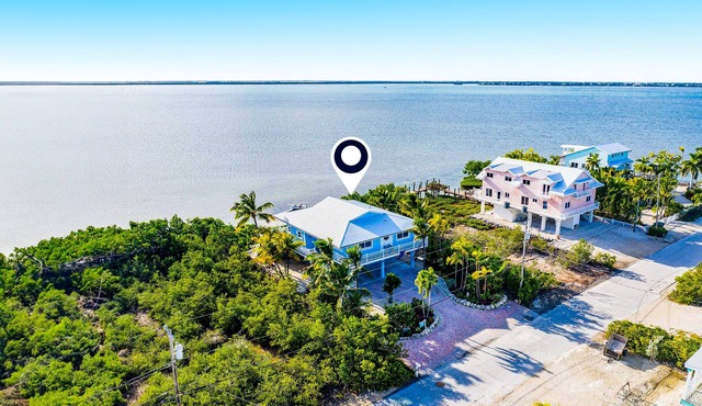 Amazing waterfront home with private beach, dock, pool, WiFi & outdoor kitchen