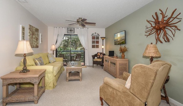 Beautifully updated bright and cheery 2nd story condo near pool beach access- SC261