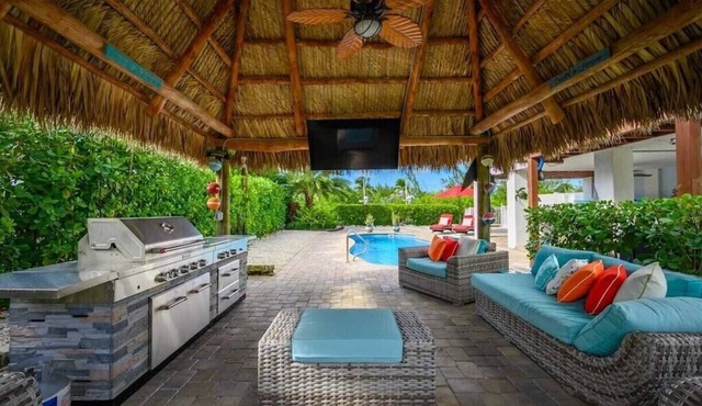 Canal Front with Dock, Private Pool, Huge Tiki Hut w/TV, Bikes, Paddleboards!