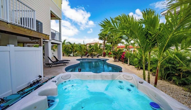 Canal Front with Large Custom Pool, Lush Landscaping, Hot Tub, 30' Dock, Kayaks!