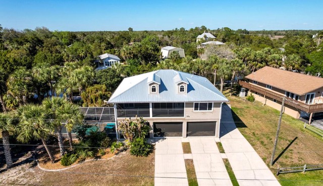 Canal home with pool, kayaks, private dock, firepit sleeps 9