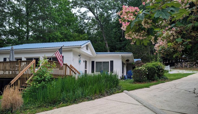 Charming 3BR/2BA lakehouse with private dock on quiet, deepwater cove.