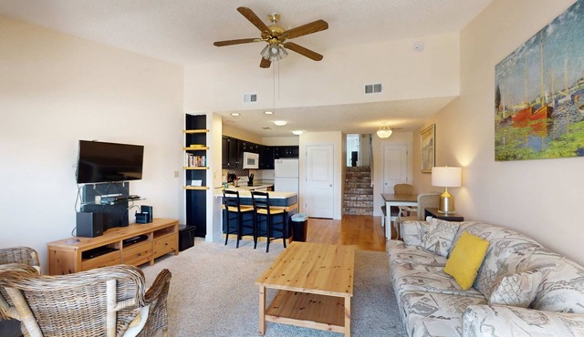 Comfortable townhome steps from beach with pool access, balcony, & W/D