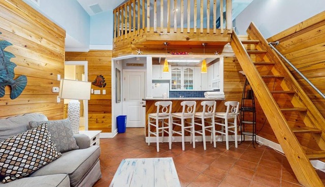 Cozy coastal condo with loft shared pool and beach access