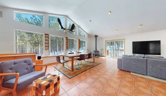 Dog-friendly home with large deck, hot tub, woodstove, W/D, & serene setting