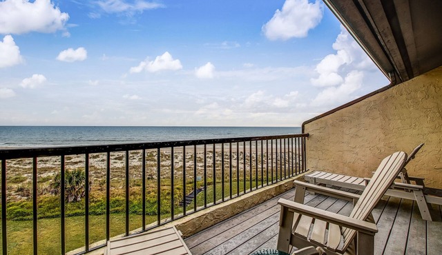 Dog-friendly oceanfront townhouse with covered balcony, views, pool & AC