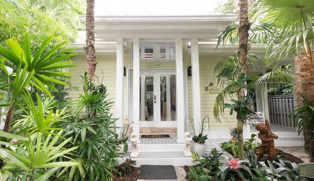 "Frangipani" is a tropical luxurious home in desirable Casa Marina neighborhood.
