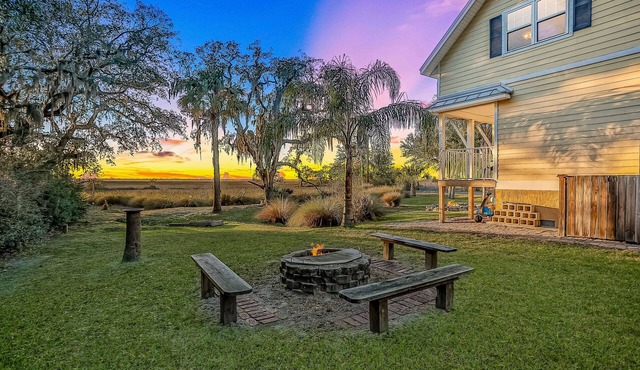 Inviting waterfront cottage with balcony, firepit, marsh views, & washer/dryer
