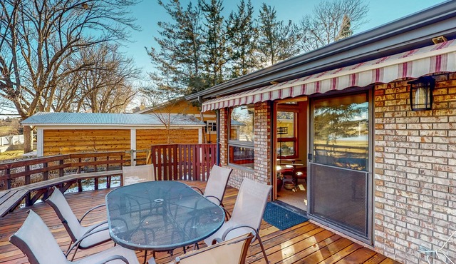 Lake-view home with gas fireplaces, inviting deck & dog-friendly yard