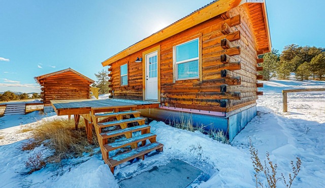Log cabin on 1,800-acre ranch with sweeping mountain & meadow views