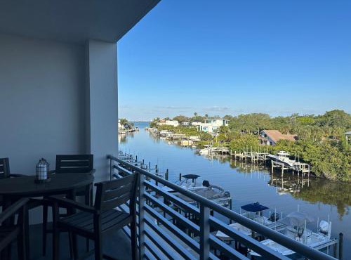 Luxury 2 Bed 2 Bath Waterfront Condo with Patio Sunsets Gym and Parking