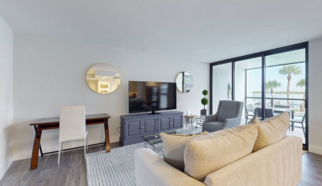 Luxury waterfront condo with shared pool, hot tub, and a tennis court