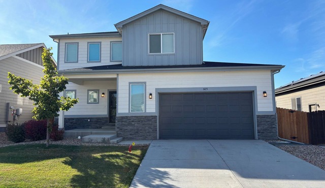 Modern home with a large fenced yard, and garage access