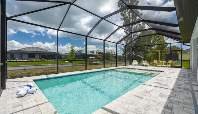 Pool overlooking canal, Outdoor Grilling station - Villa Sand Dollar Siesta