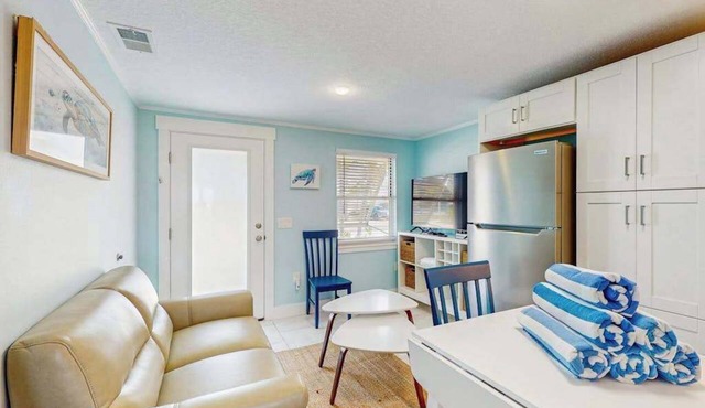 Quaint beachfront duplex villa in ideal location with screened lanai & free trolley