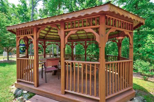 Secluded Escape Fire Pit Gazebo Dog Welcome
