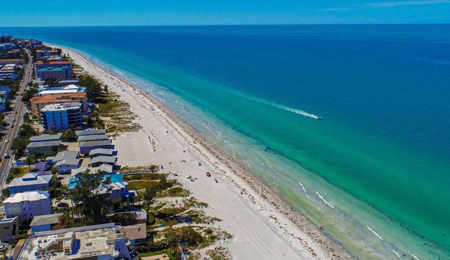Spacious and family friendly with pool dock and just steps to the beaches
