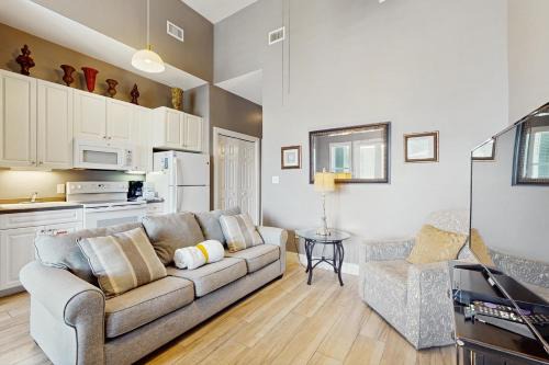 Spacious condo with large living area private balcony & shared pool