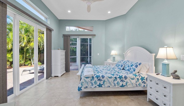 The Coral Escape – Beachside Bliss with Pool, Fire Pit, Screened Patio & Shuffleboard!