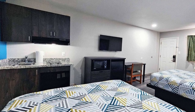 Two Queen Beds Kitchenette Non-Smoking Room at Scottish Inns and Suites!