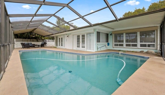 Updated Waterfront Pool Home with Putting Green
